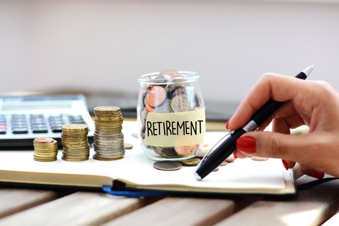 Jar of money labeled retirement.