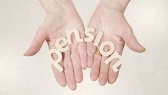 picture of two hands holding letters spelling out &quot;pension&quot;