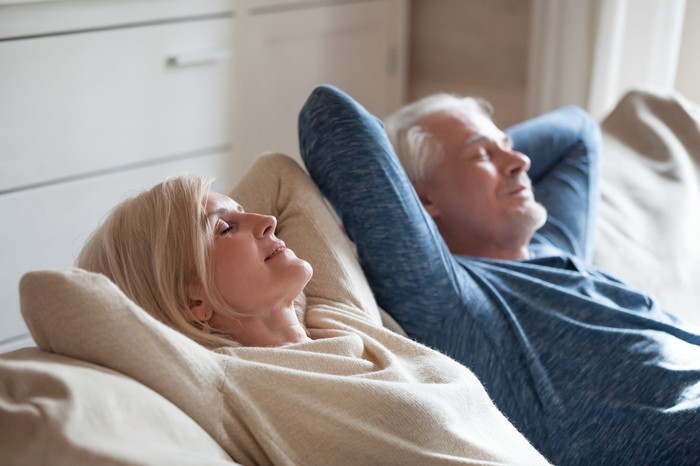 Retired couple taking a relaxing nap.