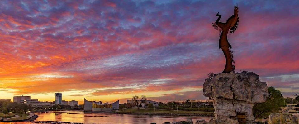 Keeper of the Plains and City Skyline at Sunrise