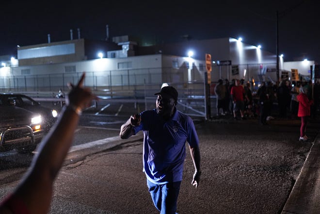 UAW Region 1D Director Gerald Kariem shouts while supporting UAW members outside of Flint Assembly as workers leave Flint Assembly early Monday, September 16, 2019 while taking part in a national strike against General Motors after stalled contract negotiations with General Motors. 