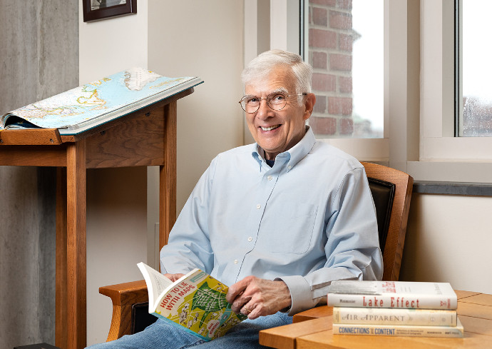 person sitting in chair at table