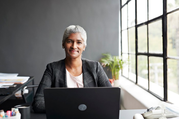 Smiling person at laptop