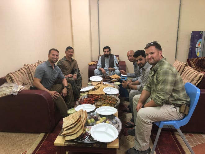 Retired Marine Col. Eric Terashima (second left) is on a mission to bring the Afghan interpreters he served with in Bost, Afghanistan to the United States.