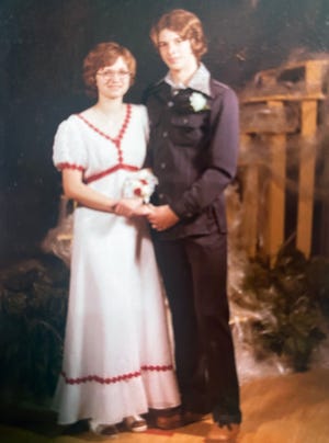 Cheryl Henry, left, and Brad Pheasant in their high school prom photo. After their own divorces, the pair had been dating for over a year.