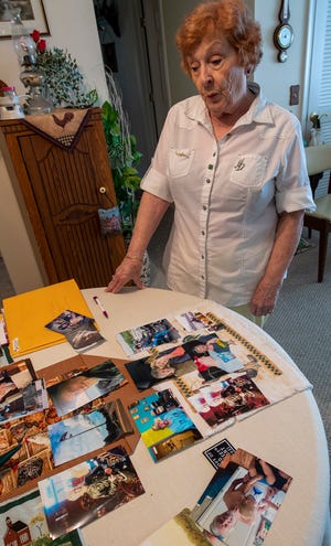 Barbara LeFevre looks over a table of memories from her son's life at her home in Dover Township.