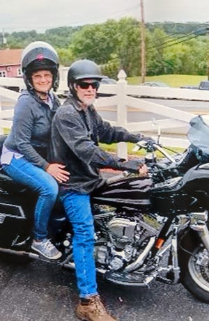 Brad Pheasant an avid motorcycle rider, right, with his girlfriend Cheryl Henry. The pair attended the prom together in high school during the 1970's