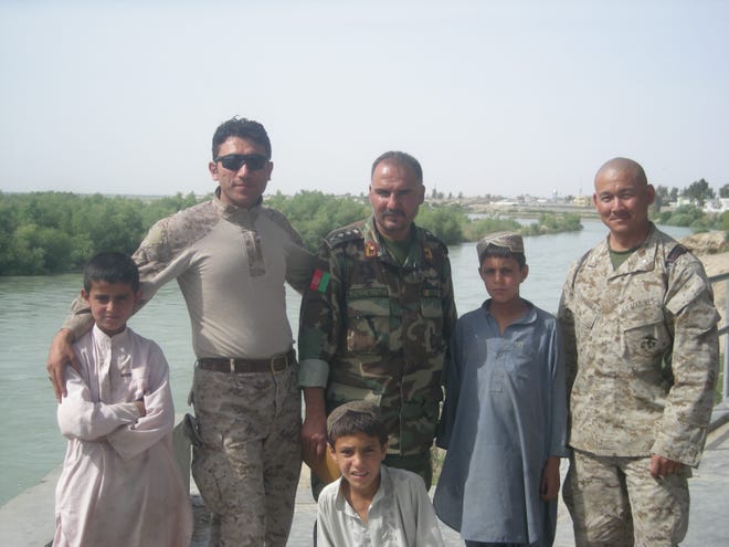 Retired Marine Col. Eric Terashima (right) is on a mission to bring the Afghan interpreters he served with in Bost, Afghanistan to the United States.