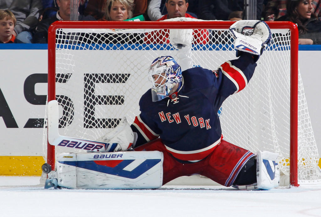 Henrik Lundqvist makes a save against the Hurricanes.