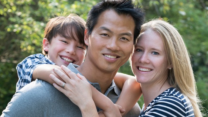 A young couple with their child.