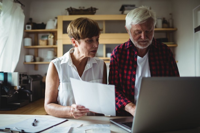 Two people at a laptop