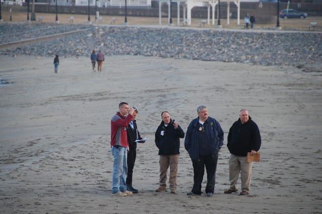 Investigators, including York Police Department Chief Charles Szeniawski, respond to Short Sands Beach the evening of Friday, March 26, to an incident involving a dead body.